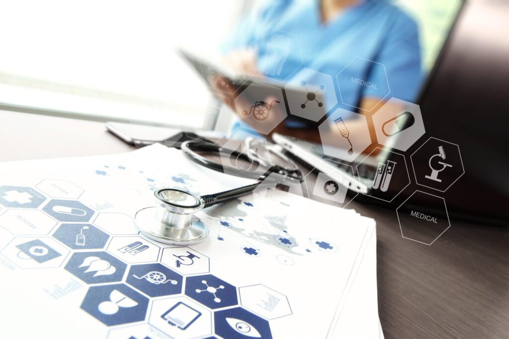 Doctor working with laptop computer in medical workspace office